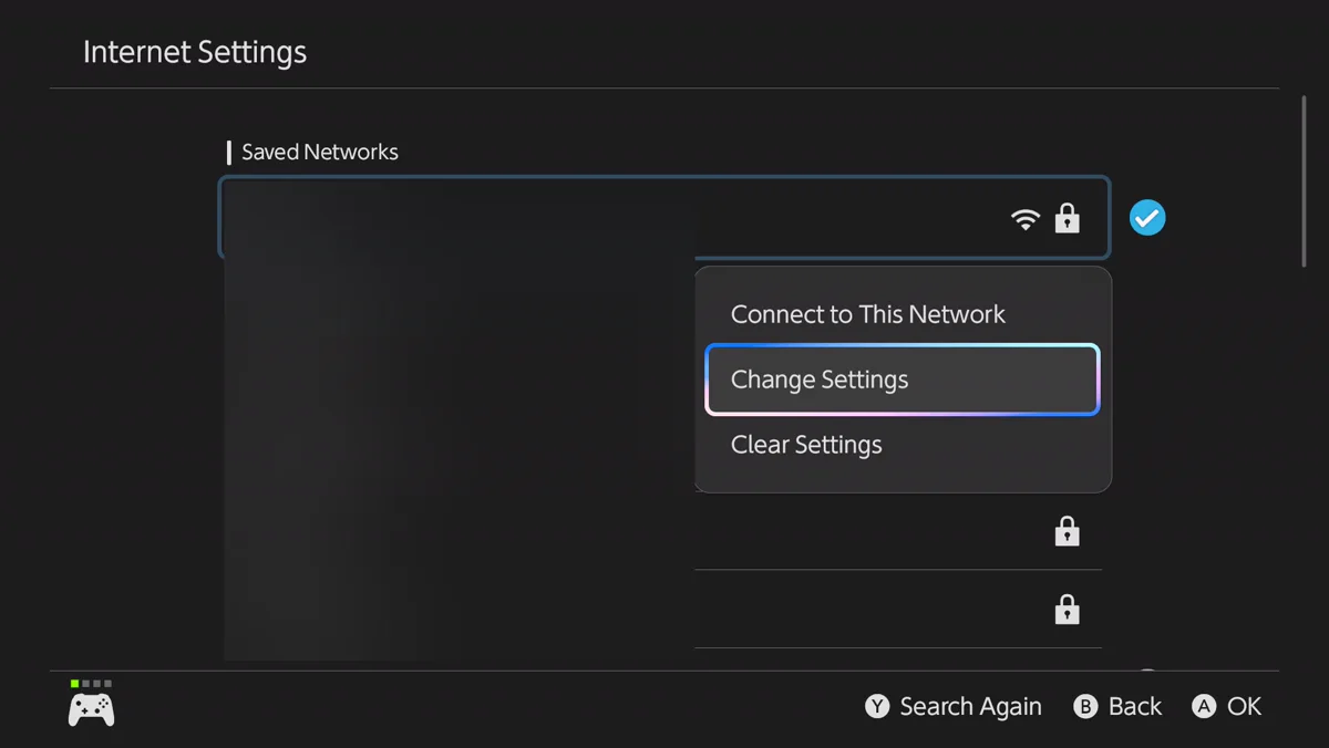 The Switch Internet Settings screen showing a list of saved networks with the names blurred out. A menu is open over the list with three choices: Connect to This Network, Change Settings, and Clear Settings. Change Settings is highlighted.